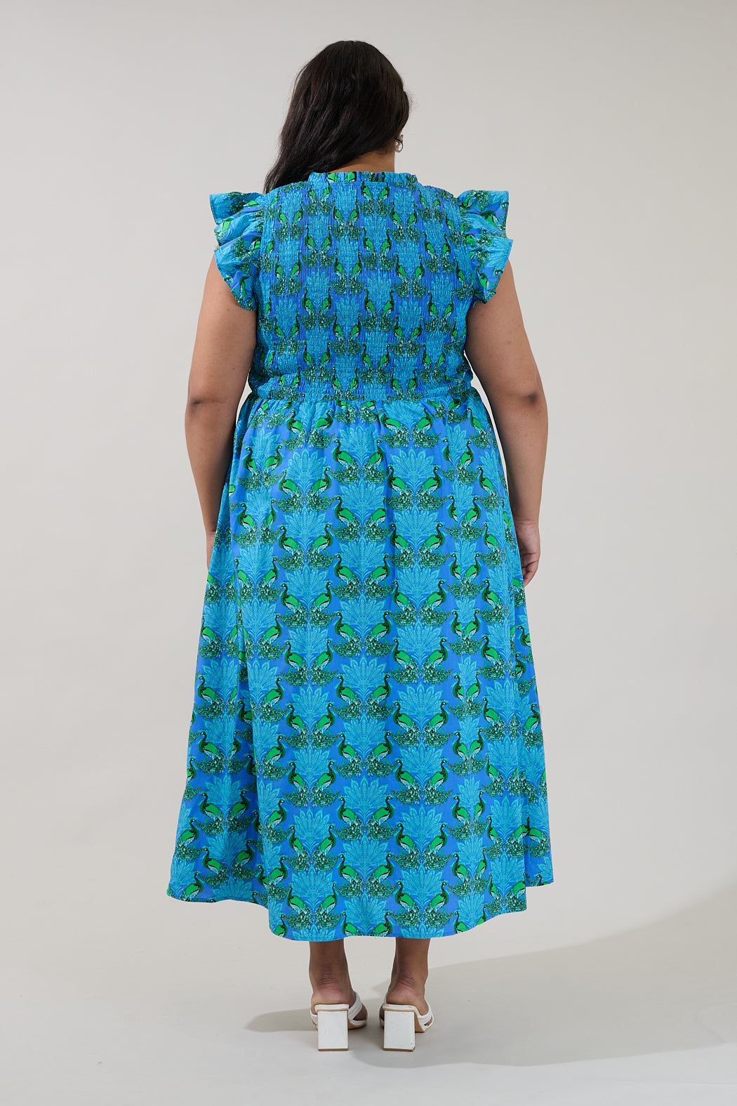 peacock blue midi dress Elegant Peacock Blue Midi Dress Turn heads in this beautifully tailored midi dress featuring: A flattering square neckline Comfortable half sleeves Flowing A-line silhouette for effortless grace Soft,
